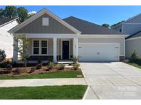 Charming single-Gathering home with a two-car garage, manicured lawn, and craftsman-style details at 606 Banter Ln # 30, Cramerton, NC 28032
