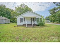 Charming single-story home with white siding, a covered porch, and well-maintained landscaping at 1343 Flint Hill St, Rock Hill, SC 29730