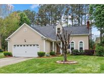 Charming single-story home with a well-manicured lawn and attached two-car garage at 1509 Kirkbridge Ct, Matthews, NC 28105