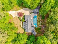 Stunning aerial view of private home with pool, lush landscaping, and mature trees at 2062 High Pines Rd, Rock Hill, SC 29732