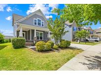 Charming home featuring manicured lawn, lovely landscaping, inviting front porch, and beautiful curb appeal at 3022 Oakmere Rd, Waxhaw, NC 28173
