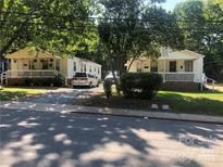 Charming homes with inviting front porches and well-maintained landscaping at 424 Skyland Ave, Charlotte, NC 28205