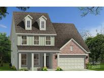Charming two-story home featuring a brick and siding exterior, dormer windows, and a two-car garage at 105 Nighthawk Trl # 20, Mooresville, NC 28115
