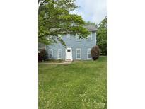 Charming two-story home featuring a fresh blue exterior, white trim, and a well-maintained front lawn at 1640 English Knoll Dr, Matthews, NC 28105