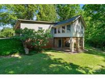 Unique home exterior featuring a sunroom on stilts and outdoor patio at 237 Fea Ln, Iron Station, NC 28080