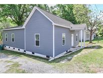 Charming home exterior featuring gray siding and a classic design at 703 S Main St, Landis, NC 28088