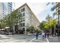 Attractive multi-story building exterior showing streetscape with sidewalks and street crossings in an urban setting at 127 N Tryon St # 511, Charlotte, NC 28202