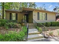 Charming single-story home featuring neutral siding, black shutters, and well-maintained landscaping at 2710 Red Bud Ln, Fort Mill, SC 29715