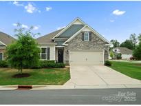 Charming single-story home with stone accents, a two-car garage, and a well-manicured front lawn at 5058 Antebellum Dr, Iron Station, NC 28080