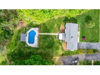 Aerial view of the home showcasing the pool, landscaping, and large backyard at 5486 Suttlemyre Ln, Hickory, NC 28601