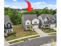 Charming two-story home with a well-maintained lawn and attractive landscaping at 190 Tetcott St, Mooresville, NC 28115
