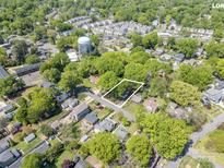 An aerial view of a charming neighborhood with mature trees and well-maintained homes at 1917 Marguerite Ave, Charlotte, NC 28205