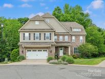 Two-story brick home with well-maintained landscaping and a two-car garage at 246 Mcduffie Ln, Fort Mill, SC 29715