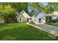 Charming home with a lush front lawn and a well-maintained driveway at 9200 Forest Green Dr, Charlotte, NC 28227
