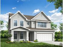 Charming two-story home featuring a two-car garage, welcoming front porch, and meticulously landscaped front yard at 2020 Embassy Ct # 48, Charlotte, NC 28213