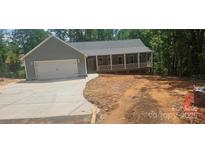 Charming home with a two-car garage and welcoming front porch at 532 Robinhood Rd # 27, Maiden, NC 28650