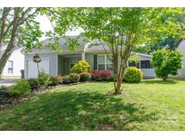 Charming home featuring a well-manicured front yard and lush landscaping at 1455 Fieldcrest Cir, Rock Hill, SC 29732