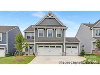 Charming two-story home with a two-car garage, stylish gray siding and manicured lawn at 2309 Bulwarks Ct # 4P, Albemarle, NC 28001