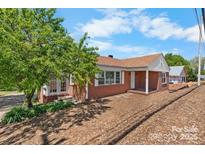 Charming brick home with a well-maintained lawn and inviting curb appeal at 3015 North Center Nw St # 6, Hickory, NC 28601