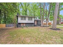 Charming two-story home with a modern black and grey exterior and landscaped front yard at 3619 Bankston Pl, Charlotte, NC 28215