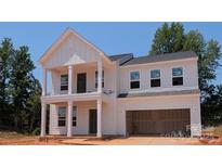 Charming two-story home featuring an attached two-car garage and classic design elements at 110 Canary Ln # 3, Mooresville, NC 28115