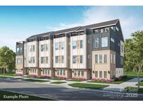 Modern townhome features a roof deck, a neutral color palette, and beautiful landscaping at 233 Cherokee Rose Ln # 31, Charlotte, NC 28217