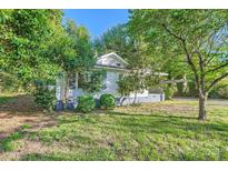 Charming single-story home with mature trees and grass at 828 Richard Ave, Kannapolis, NC 28081