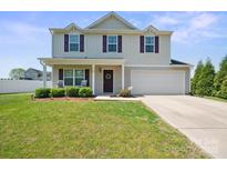 Charming two-story home with a well-maintained lawn and a two-car garage at 118 Maplecrest Dr, Kings Mountain, NC 28086