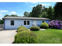 Charming single-story home with a well-maintained lawn and beautiful landscaping at 2263 Starbrooke Dr, Newton, NC 28658