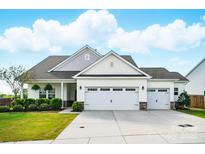 Charming one story home featuring manicured landscaping and a three car garage at 1116 Brooksland Pl, Waxhaw, NC 28173