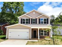 Charming two-story home with a classic design and a well-manicured lawn at 601 Westway Dr, Gastonia, NC 28054