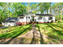 Charming home featuring a well-maintained front yard and a classic exterior design at 118 Taylor Ct # 16, Mooresville, NC 28117