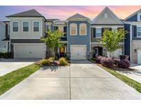 Charming townhome featuring a neatly manicured front yard and an attached garage in a desirable neighborhood at 314 Embers Ln, Clover, SC 29710