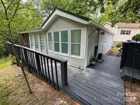 Charming home exterior with well-maintained siding and a lovely deck at 127 Hummingbird Cir, New London, NC 28127