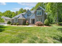 Beautiful two-story home with a well-manicured lawn and mature trees at 1959 Landry Ln, Rock Hill, SC 29732