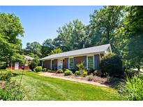 Charming single-story home with manicured front lawn and inviting curb appeal at 2100 Stonewood Dr, Charlotte, NC 28210