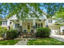 Charming home with a welcoming porch, brick stairs, and a well-manicured front yard at 1038 Gardenia St, Fort Mill, SC 29708