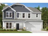 Two-story home with a black front door, gray shingles, siding, a two-car garage, and manicured landscaping at 1227 Fremont Dr, Wingate, NC 28174