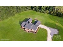 Expansive aerial view showcasing the property's lush green lawn and well-maintained roof at 1488 Ernest Rd, York, SC 29745