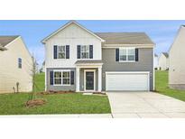 Charming two-story home with a well-manicured lawn and a two-car garage at 1530 Cottage Creek Dr, Bessemer City, NC 28016