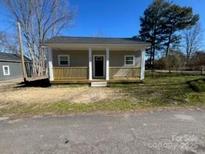 Charming single-story home featuring a cozy front porch and manicured lawn at 567 5Th St, Chester, SC 29706