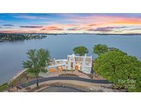 Stunning waterfront home with lake views and lush landscaping at 8397 Ranger Island Marina Rd, Denver, NC 28037