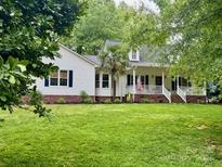 Charming single Gathering home featuring a lush lawn and an inviting front porch at 432 Partridge Pl, York, SC 29745