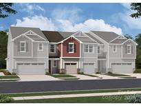 New construction craftsman-style townhomes featuring attached garages and professionally landscaped yards at 2013 Vinyasa Ln # Sts-43, Charlotte, NC 28215