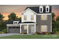 Charming two-story home featuring brick and shingle siding, dormer windows, and a manicured lawn at 2217 Riverbend Ave # 65, Monroe, NC 28110
