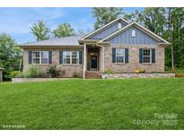 Charming brick home with a well-maintained front lawn and inviting curb appeal at 876 Hardin St # B24, Lancaster, SC 29720