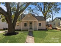 Charming home with landscaped front yard, quaint porch, and inviting curb appeal at 1314 Ordermore Ave, Charlotte, NC 28203