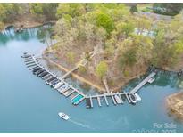 Aerial view showcases a boat dock with multiple slips, offering convenient lake access for boating enthusiasts at 2620 Shady Reach Ln, Charlotte, NC 28214