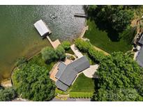 Stunning aerial view of lakefront home with private dock and lush landscaping at 273 Leeward Point Loop # 14, Taylorsville, NC 28681