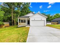 Charming single-Gathering home with a well-manicured lawn and a two-car garage, offering modern comfort at 404 S Greenbriar Rd, Statesville, NC 28625